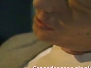 Crossdressing shemale blows a guy and fucks in a bar