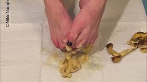Mashing a banana with my feet wearing lingerie