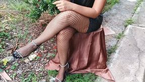 She smokes a cigarette while keeping high heels dangling and legs crossed (3)