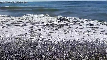 Skinny brunette girl gets fucked with DP by three guys on the beach