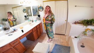 The blonde woman is on her knees and ready to suck