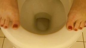 Toes in a public women's toilet in a shopping mall