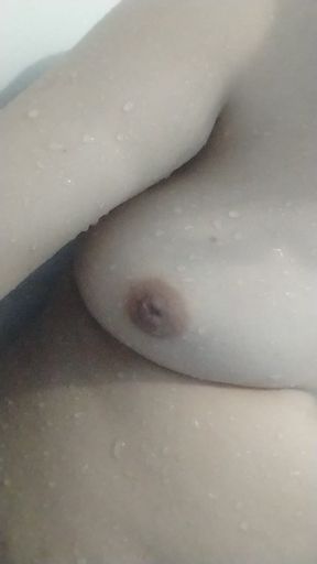 Staife in a shower and play with her breasts