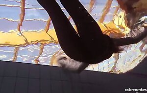 Zuzanna swims naked and horny in the pool