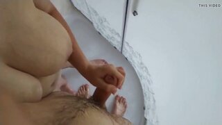 Nude German MILF strokes hubby's cock in the shower