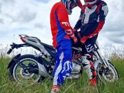 Hot motocross boys cum near motorcycle