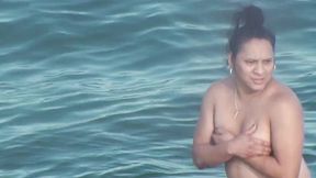 Chubby latina mom swims in the see without bra