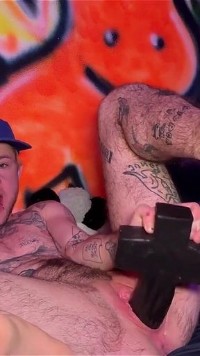 Tattooed Tboy XXX Skips Stretches His Pink Boy Pussy with an Xl Cross Dildo
