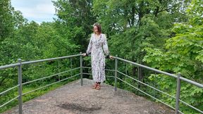 Sofi is tied with black ropes to a railing in the park_Viborg