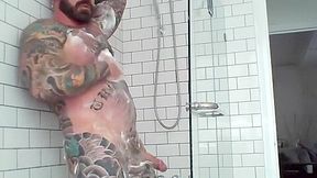 Tattooed muscle stud showers