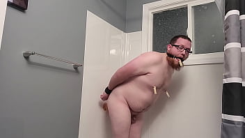 Bitchboy bondaged and fucks self in shower