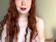 Amateur redhead Dasha with glasses masturbates