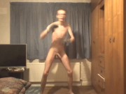 Skinny twink in boxing gloves does shadow boxing and shows off his ribs