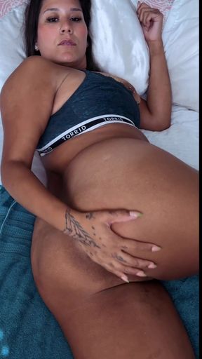 Pregnant woman lying on bed