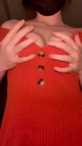 Masked while undressing orange dress