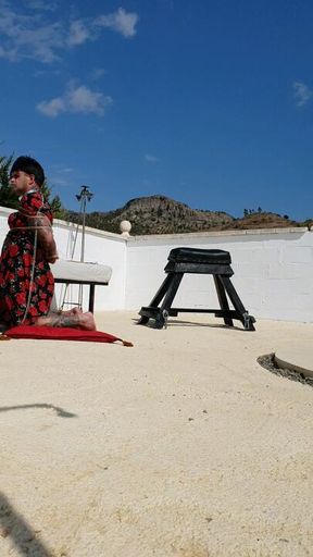 Slipper spanking in the sun