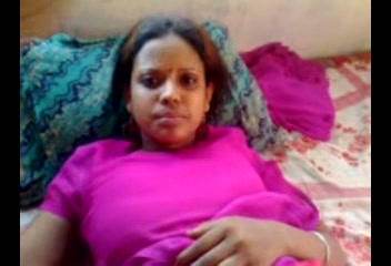 Submissive genuine Indian dark skin lady in sexy red outfit