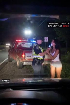Police officer and woman in car