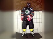 Rubber hockey pup pawing off