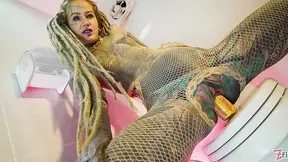 Tattooed beauty fingers and pees hard in fishnet stockings
