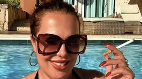 Your favorite stepmother, smoking Marlboro Gold in the pool of my suite in Punta Cana