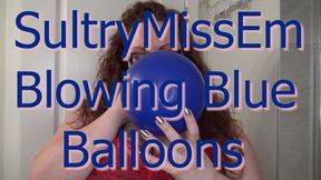 Blowing blue balloons