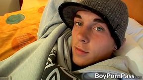 Tattooed young guy Kelly Cooper jacks off his long hard dick