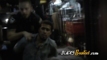 Wild interracial threesome in a dirty garage with two big ass MILF officers.