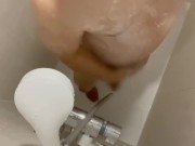 Japanese guy pissing while taking a shower