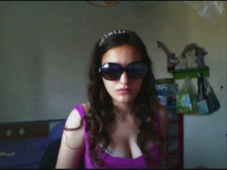 Hot camgirl with sunglasses flashes her big boobies