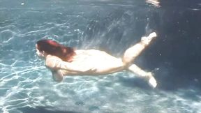 An awesome BBW babe Cherry Brady swims in the pool with boobs naked
