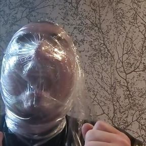 Breath play with cling film wearing latex catsuit