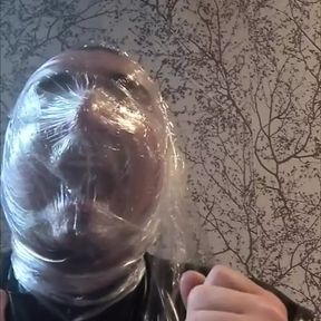 Breath play with cling film wearing latex catsuit