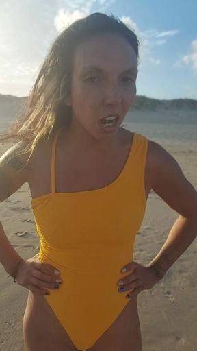 "The feet of Mademoiselle walk on the sand near the sea."