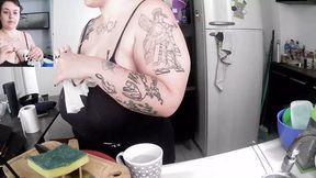 Saggy-Titted Milf Gives Peek at Cleavage While Doing Dishes