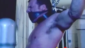 Muscular hunk tied up and whipped in bondage session