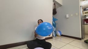 Akina blows up balloons