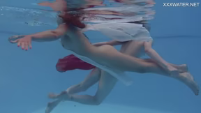 Girlfriends enjoy swimming naked together