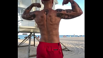 FLEXING BACK AT BEACH