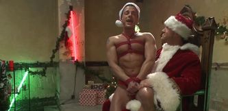 Submissive guy enjoys a Christmas-themed gangbang