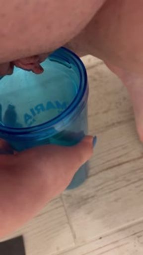 Peeing into a cup
