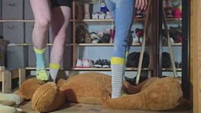 Chrissy and Dan crushing a huge stuffed toy
