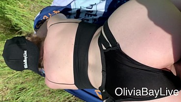 Olivia Bay riding a cock on the sunny day