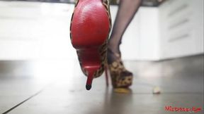 Closeup view (POV) on my new high heel shoes crushing candies