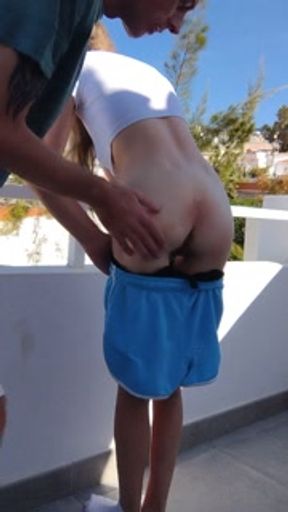 Petite gorgeous bum gets spanked over balcony in tenerife
