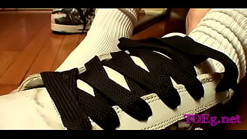 Twink jerks off with feet