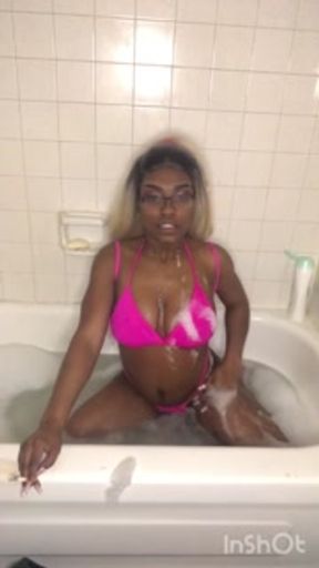 Ebony smoking milf strips in bathtub