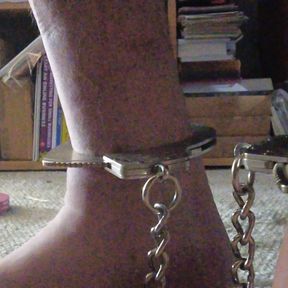 Male Slave with sports socks and Smith and Wesson Leg Irons