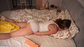 Hot Girl watches porn and masturbates on the bed with her fingers until orgasm