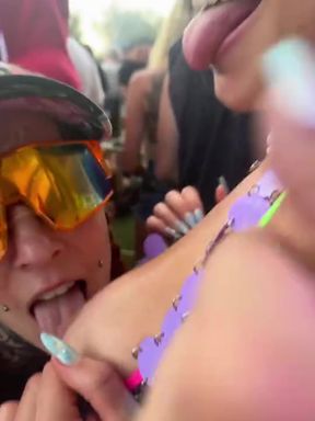 Festival amateur lesbians share a public kiss
